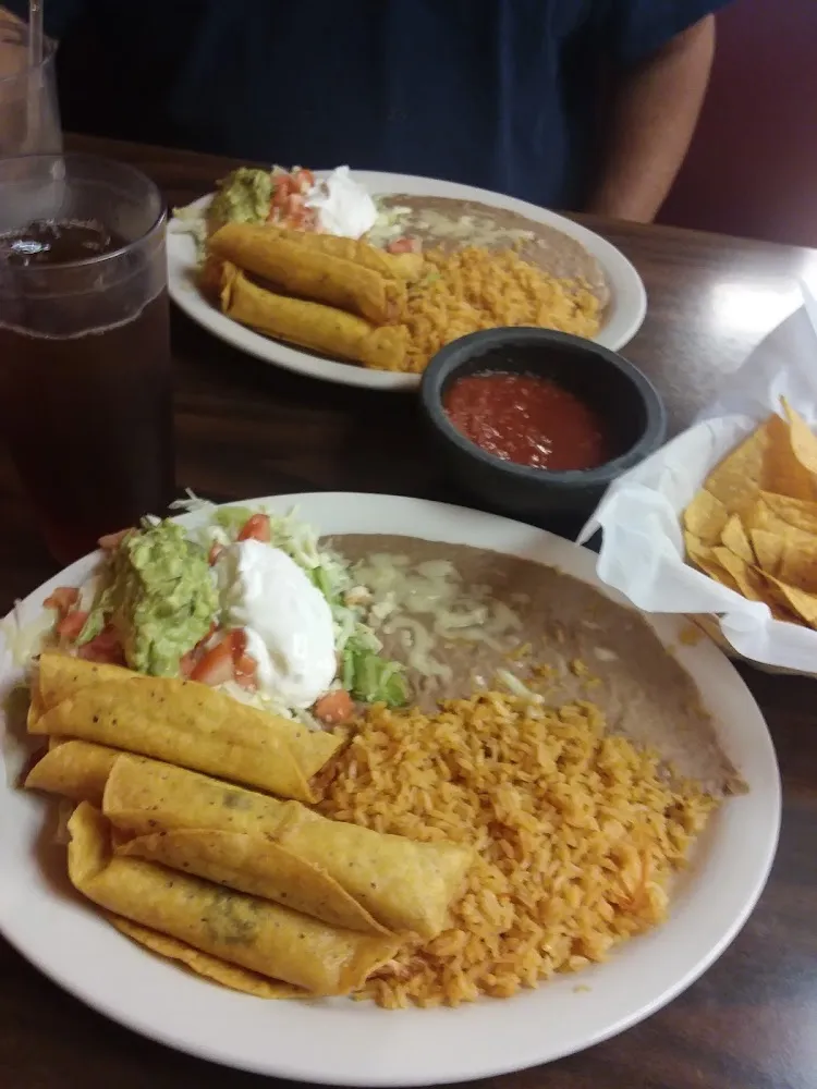 Taquitos Mexicanos with Beans Rice and Salad